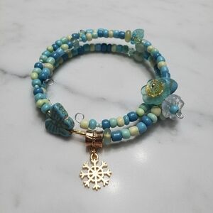 Wire Blue and Gold Beaded Bracelet with Ships Wheel Charm